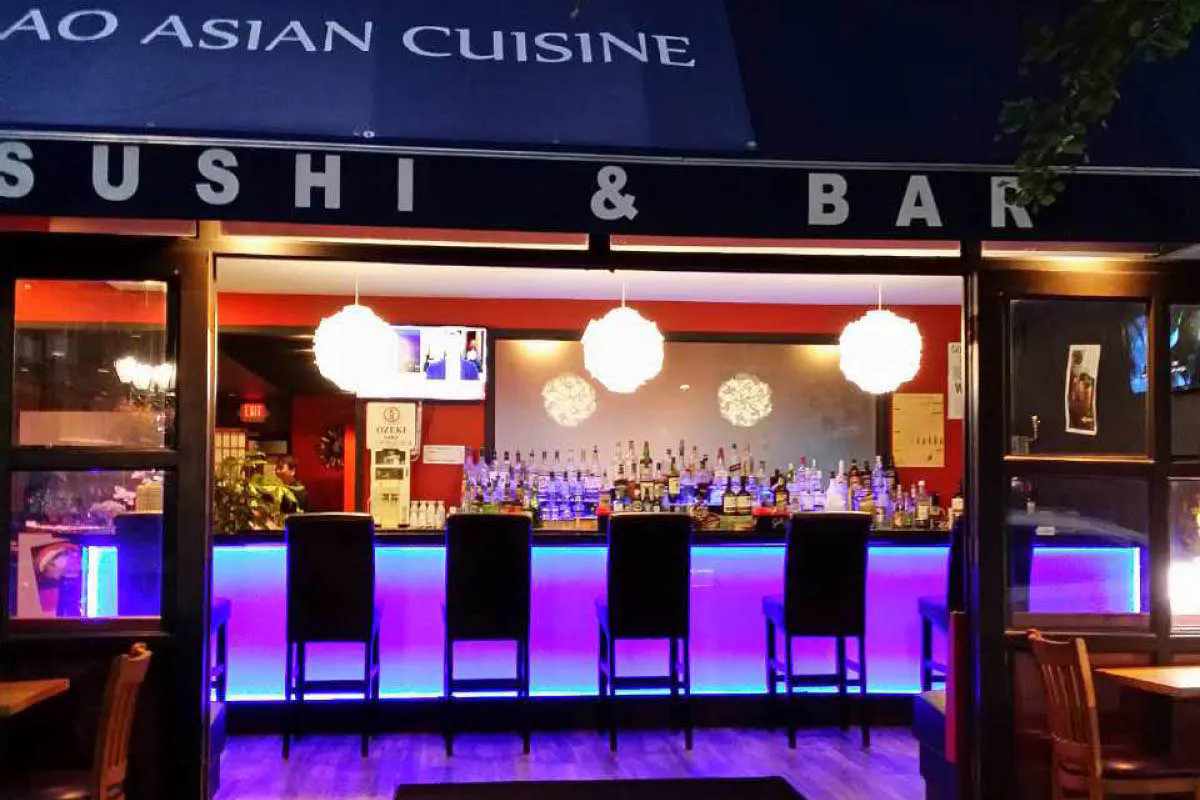 Neon sushi bar with blue and purple lighting at Yahao Asian Cuisine，an Asian Fusion Restaurant in Great Neck