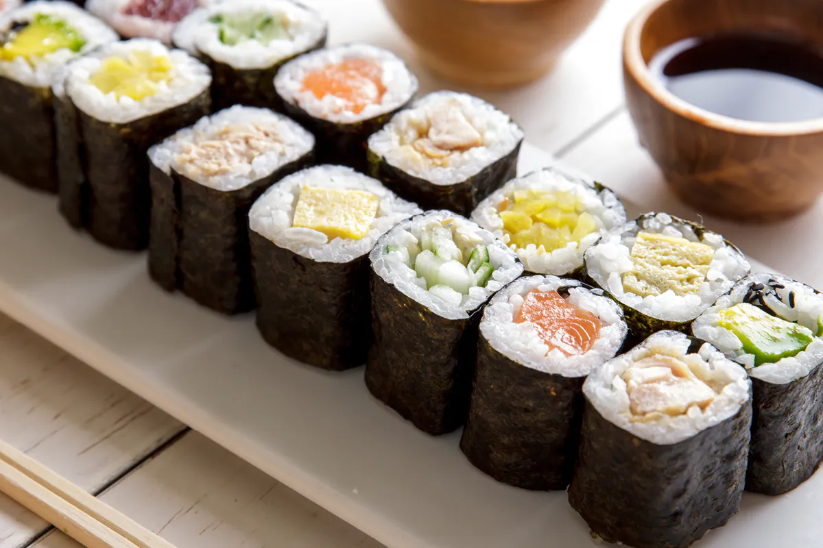 Assorted maki rolls with soy sauce cups at Yahao Asian Cuisine，an Asian Fusion Restaurant in Great Neck